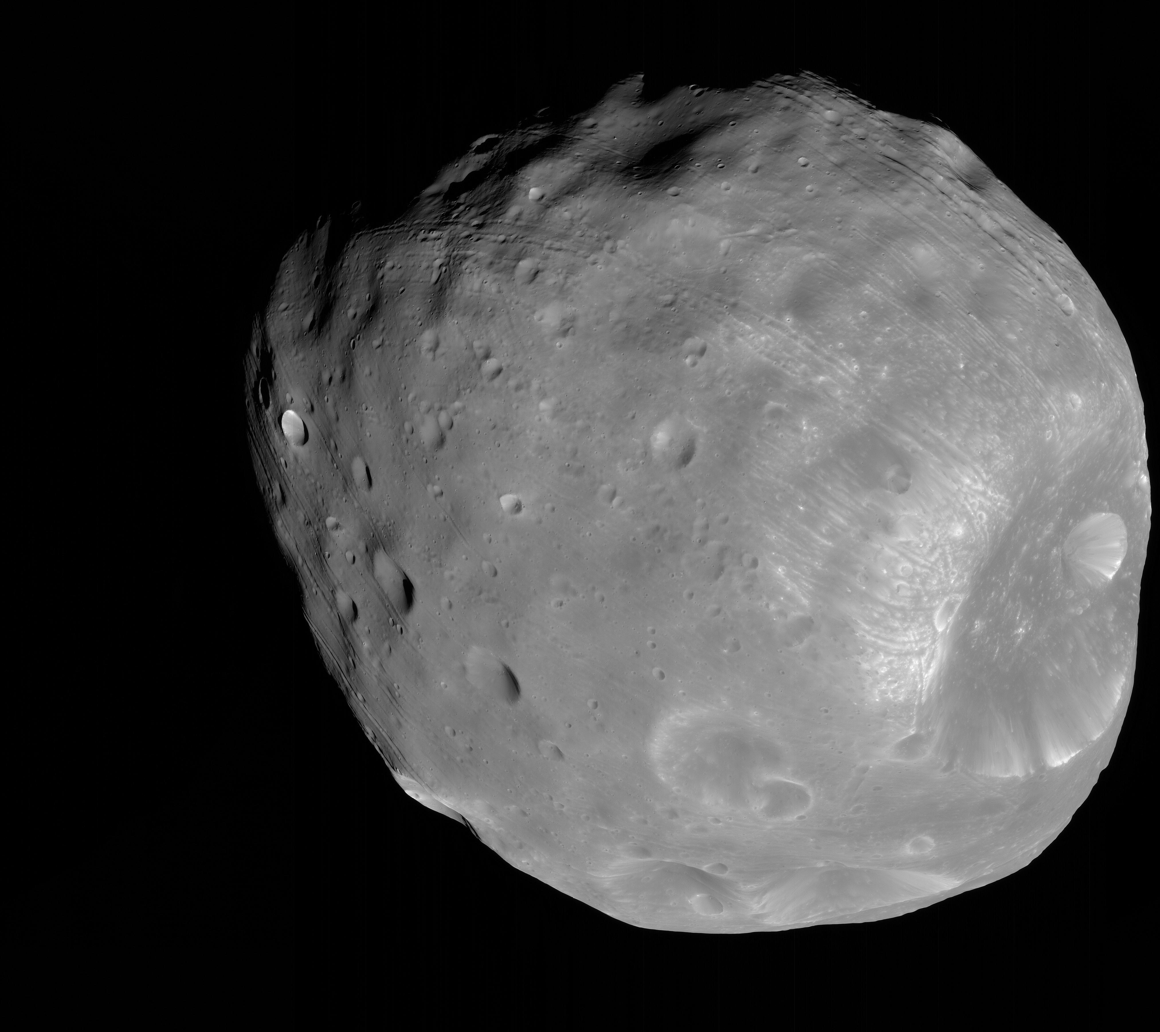Phobos, a small cratered potato-shaped moon, with the large Stickney crater at the lower right.